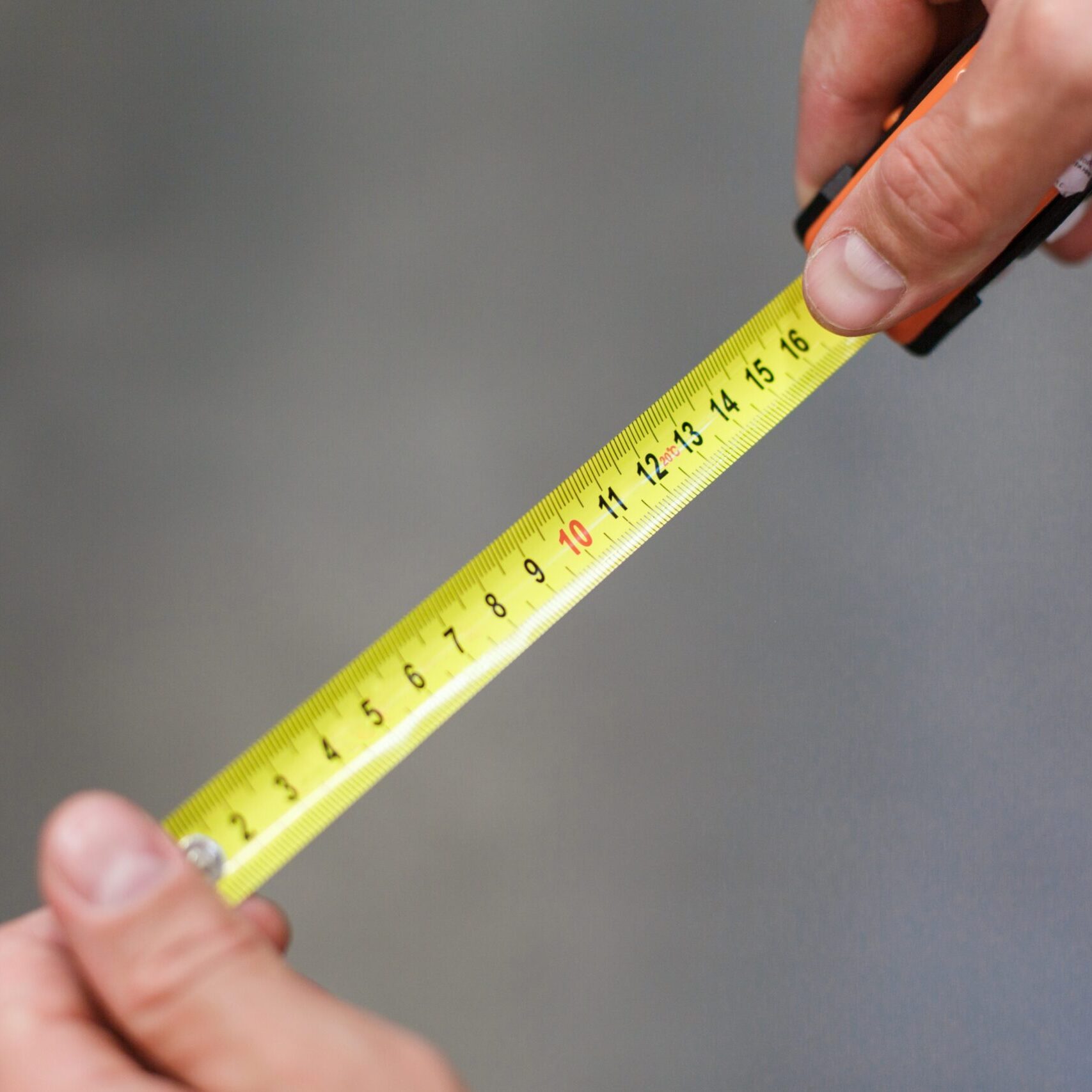 construction-tape-measurement-the-man-measures-w-2023-11-27-04-49-16-utc